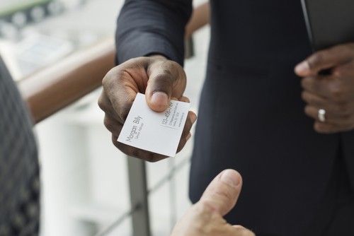 Person handing over their business card